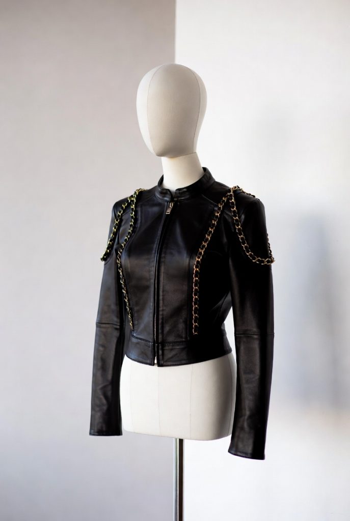 Authentic Chanel Black Lambskin Leather Jacket with Signature Gold Chain Accents