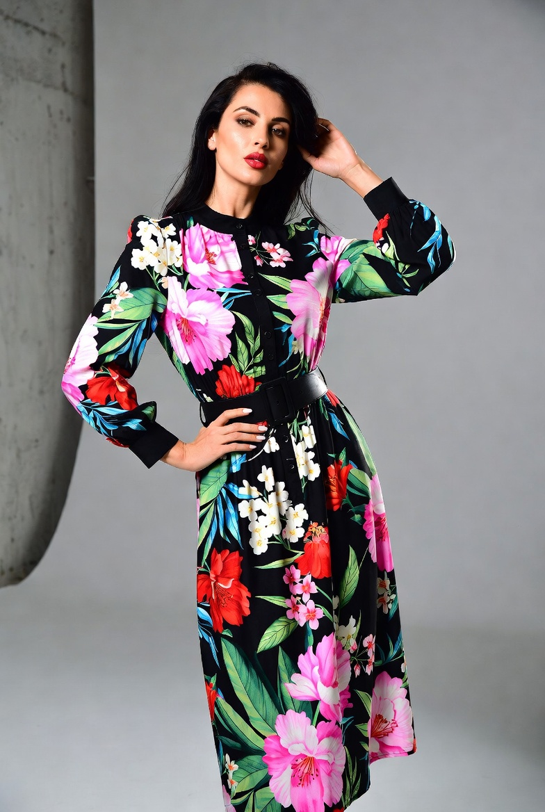 Elegant woman wearing an authentic Dolce & Gabbana Floral Print Midi Dress featuring luxurious silk fabric, vibrant Sicilian-inspired floral prints, a fitted bodice, flared midi skirt, and timeless Italian designer styling.