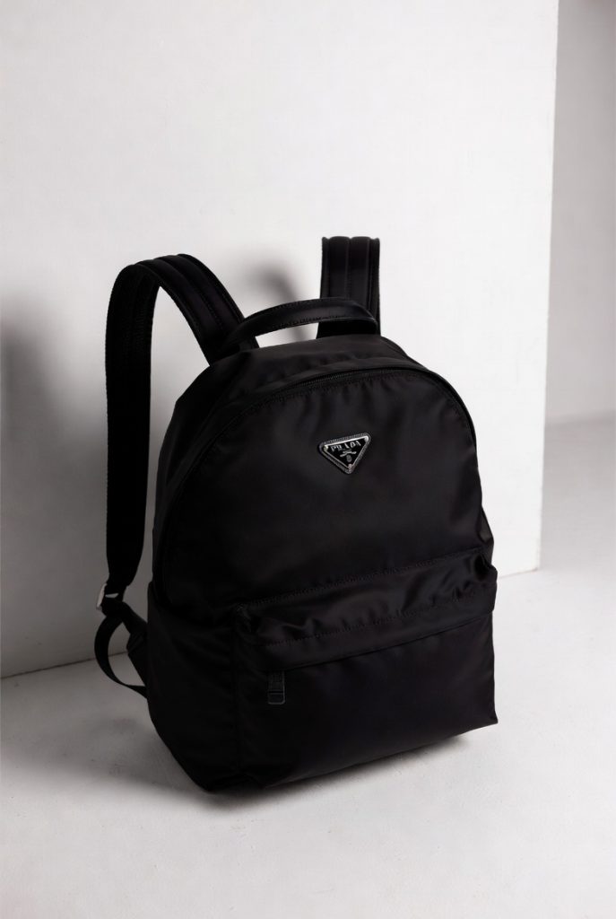 Prada Re-Nylon backpack crafted from sustainable recycled nylon with leather trim and signature logo